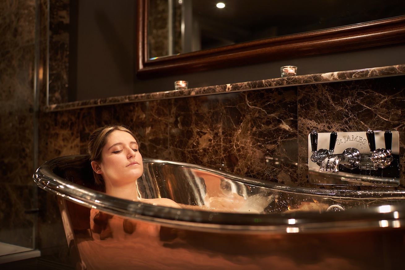 Woman in bath at Driftwood Spa